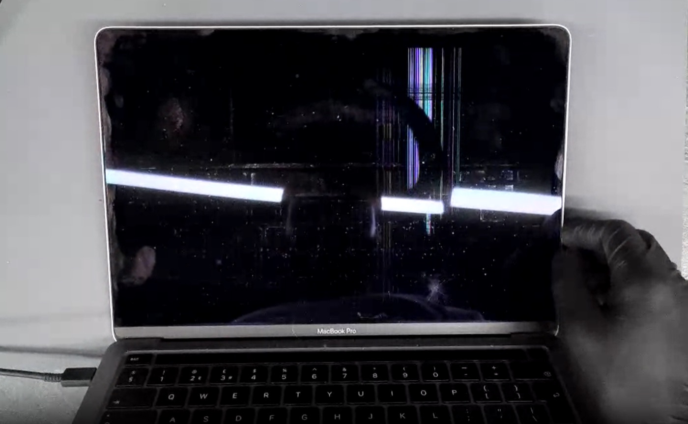 MacBook screen physical damage example — Dead panel with backlight banding and internal lines